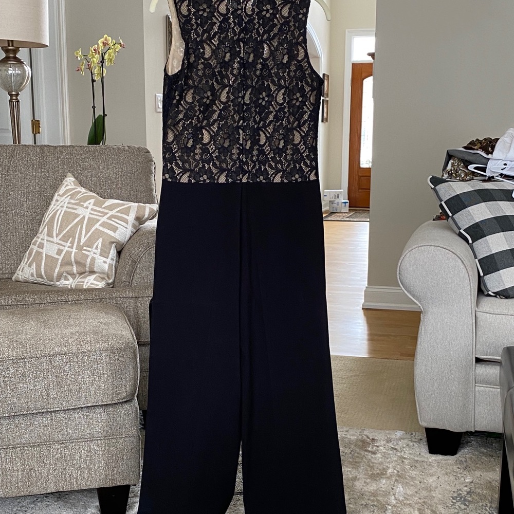 Venus romper size 4. Black and beige. . Excellent condition